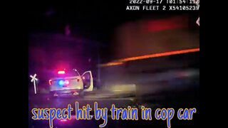 Suspect hit by train in cop car!