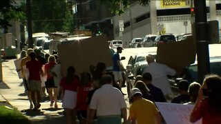 School officials, parents, and students rally in downtown Milwaukee for in-person learning