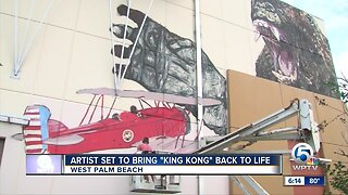 Artist painting King Kong mural in West Palm Beach