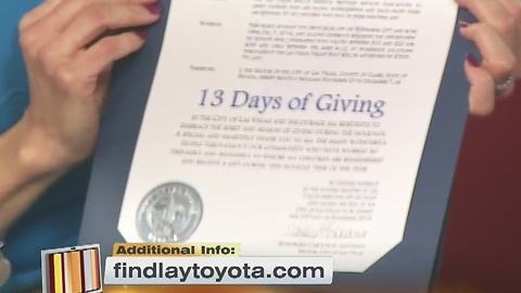 Oscar Goodman with a 13 Days of Giving proclamation for KTNV and Findlay Toyota