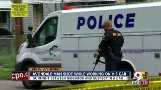 Man shot while working on his car