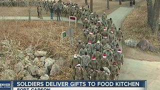 Soldiers deliver gifts to food kitchen