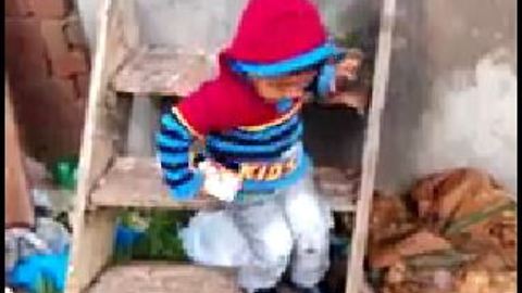 Small boy is playing on artificial Stairs