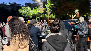 “They’re Not Gonna Move” Rashida Tlaib and Protesters Stand in Front of Police Car at WSU