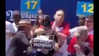 Joey Chestnut Tackles Protester Mid Hot Dog Eating Contest