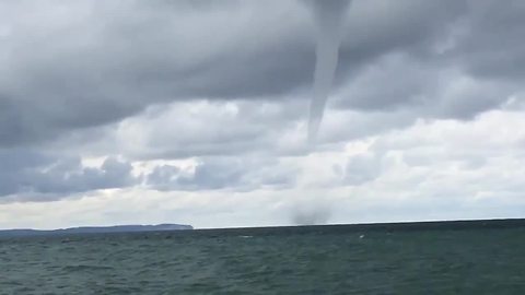 Couple on honeymoon captures waterspout on Lake Michigan