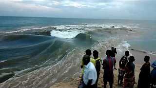 Spectators Observe As River Mixes With Sea In Tamil Nadu