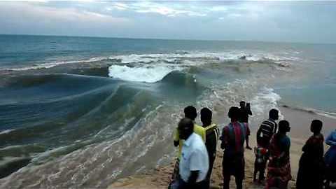 Spectators Observe As River Mixes With Sea In Tamil Nadu
