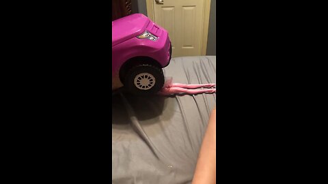 Barbie trying to fix her Jeep
