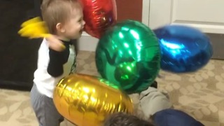 Toddler super excited to bang around balloons!