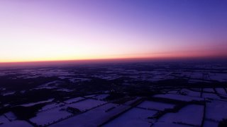 Spectacular winter sunset filmed by high altitude drone at 2,000 feet