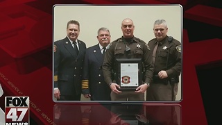 Deputy honored after rescuing 3 from burning condo