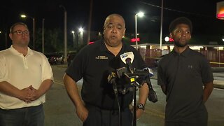 Commissioner Michael Harrison reacts to triple shooting