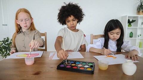 A Girl And A Boy Making Liquid Coloring To Make Easter Eggs