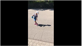 Little girl tries to run away from her own shadow