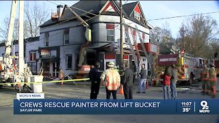 Crews rescue painter from lift bucket after fire