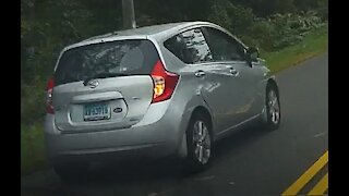 Nissan Versa Passes on Double Yellow Approaching a Blind Corner