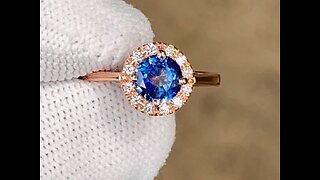 Custom made blue sapphire and diamond ring with rose gold