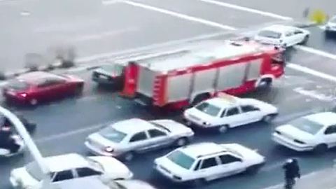 Motorists giving way to fire engine truck