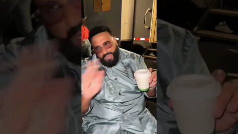 Drake showing his diamond to DJ Khaled.