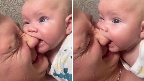 Teething Baby Tries To Chew On Dad's Nose