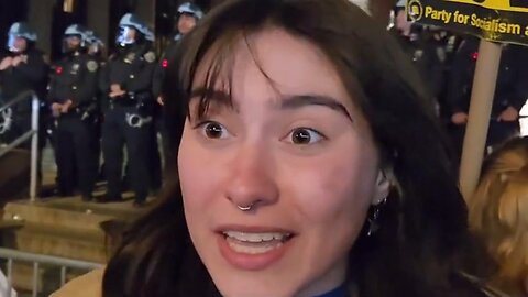 Doesn't Know Why She's Protesting at NYU - Asks Friend, "Why are we protesting, here?" Her friend said she didn't know either.