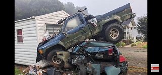 Truck Parks on top of car