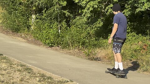 Yung Paul Mobbing Down Large Hill At Riverfront on Longboard