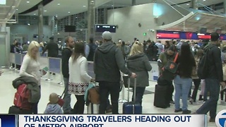 Travelers heading out of Metro Airport for Thanksgiving