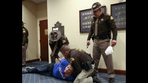 INFURIATING! Senate handcuffs man for "We the People" T-shirt and "Yes HB60" Sticker