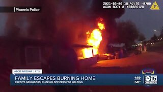 Must-see video: Phoenix police officers help rescue family from house fire