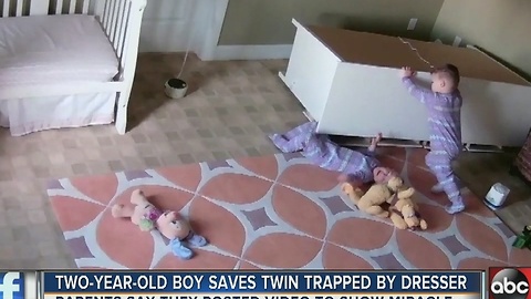 Two-year-old boy saves twin trapped under dresser