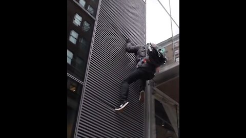 Left Wing Protestor FALLS While Trying to Climb NYC Building