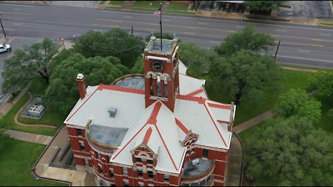 Drone view of the Beautiful Historic 128yo Lee County Courthouse in Downtown Giddings Texas