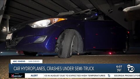 Car crashes underneath semitruck