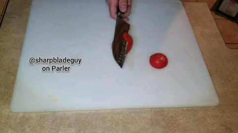 Slicing a tomato without holding it.