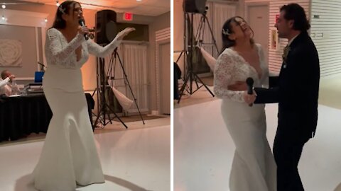 Bride delivers surprise rap for husband during wedding