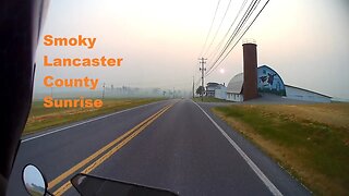 Grom motorcycle ride in forest fire smoke at sunrise in Lancaster County Pennsylvania