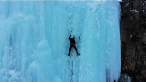 Mountaineers climb frozen waterfall