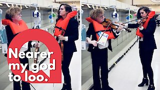 Violinists serenade empty loo roll shelves with Titanic hymn