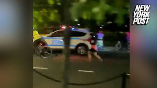 Driver hits two protesters near Brooklyn Bridge, NYPD car clips cyclist