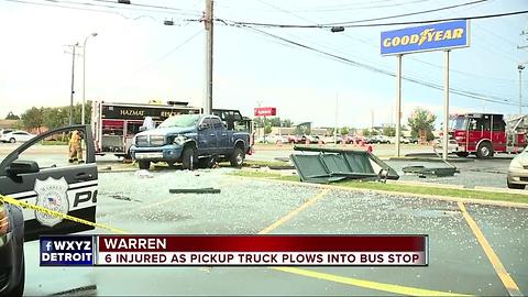 6 injured as pickup truck plows into bus stop