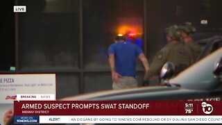 Armed suspect surrenders after Midway District standoff