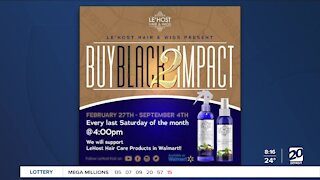 Local business owners holing Buy Black 2 Impact Our Community
