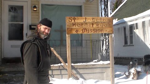 Brother Joseph puts up a sign