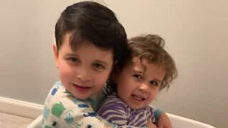 Little girl pushes brother off of bed