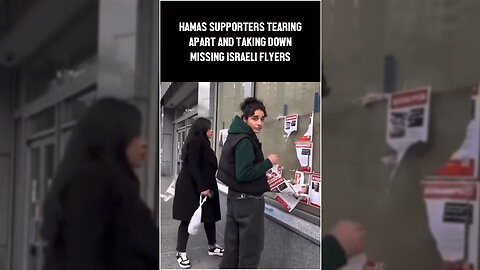 Hamas Supporters Tearing Apart And Taking Down Missing Israeli Flyers