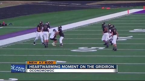 Opposing player lets Wisconsin boy with Down syndrome make his first tackle in football game