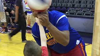 Boy Jumps For Joy After Harlem Globetrotter Teaches Him To Spin Basketball