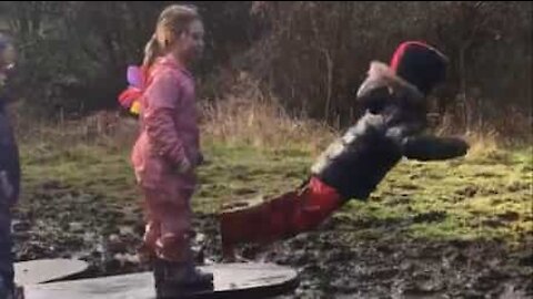 Boy falls face-first in puddle of mud!